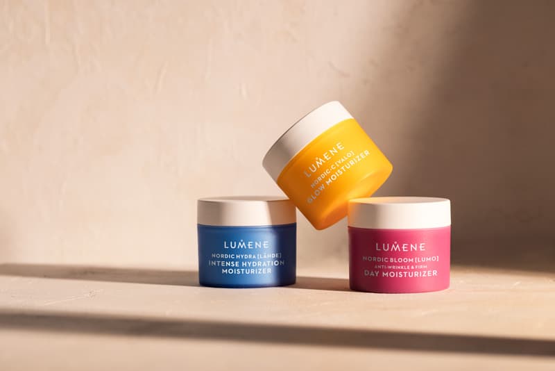 Tre fuktkrämsburkar från LUMENE mot en ljusbrun bakgrund.